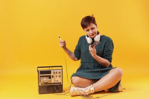 hipster-senior-woman-looking-cassette