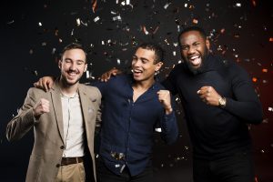 men-cheering-surrounded-by-confetti-party